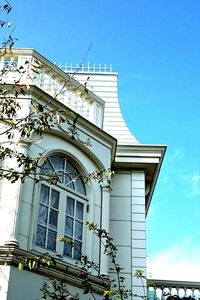 Low angle view of buildings against clear blue sky