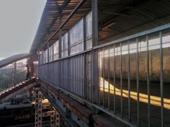 Low angle view of train against buildings