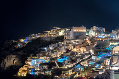 High angle view of illuminated buildings in city at night