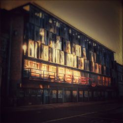 Illuminated building in city at night