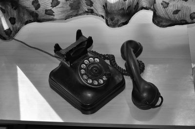 High angle view of telephone on table