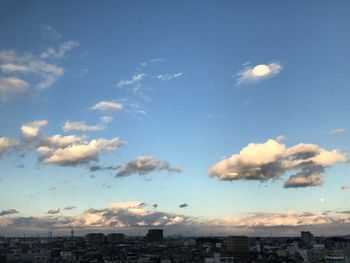 Aerial view of cityscape against sky