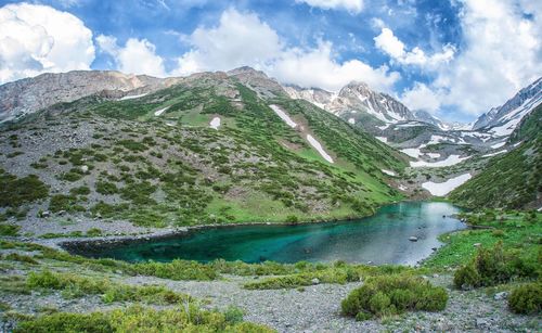 Scenic view of lake and mountains against sky