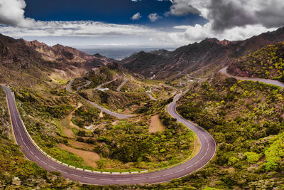 High angle view of road amidst mountains against sky