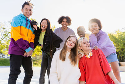 Friends standing against white background