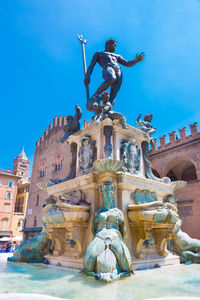 Low angle view of statue against building