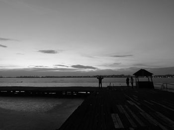 People on beach against sky