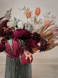 Close-up of red flower vase on table