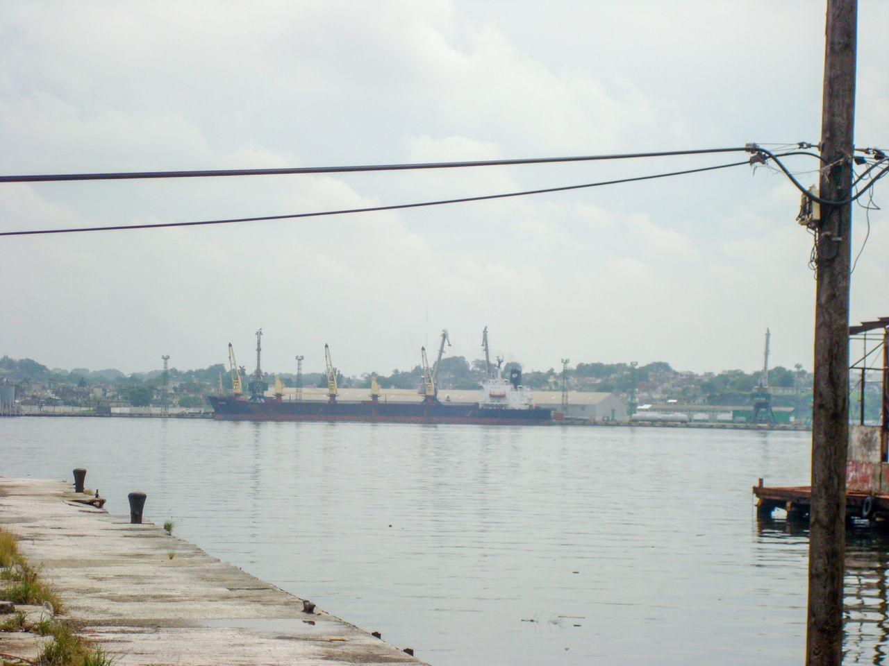 VIEW OF HARBOR AGAINST SKY