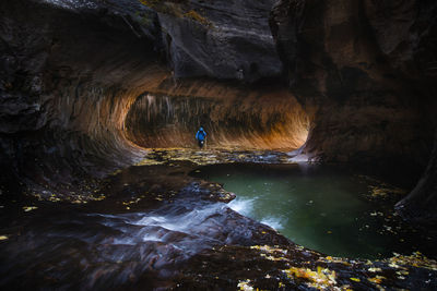 Man surfing in cave