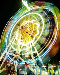 Low angle view of illuminated ferris wheel