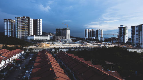 Modern buildings in city against sky