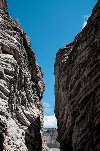 Low angle view of rock formation against clear sky