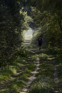 Full length of woman walking on footpath