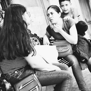 Woman sitting with text