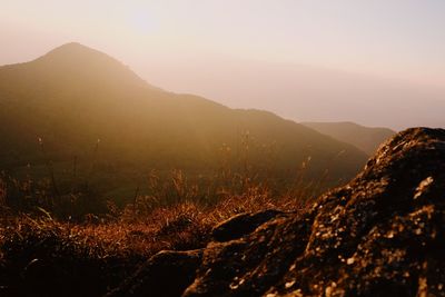 Scenic view of mountains against sky during sunset