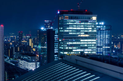 Illuminated buildings in city at night