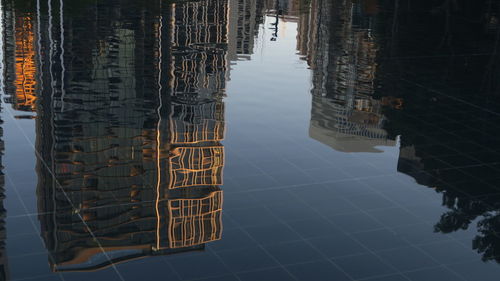 Reflection of building on swimming pool