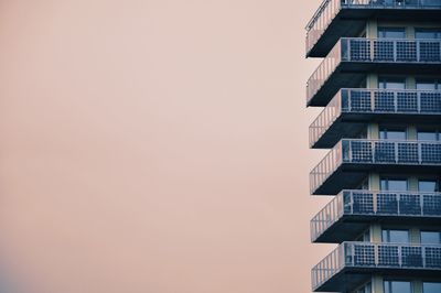 Low angle view of building against sky during sunset