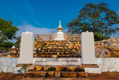 Buddhist stupa isolated with amazing blue sky from unique perspective