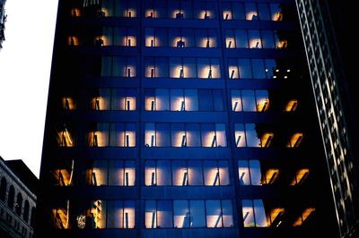 Low angle view of modern building at night
