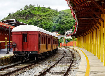 Train on railroad track against sky