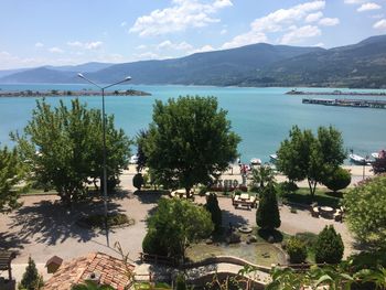 High angle view of trees by sea against sky