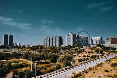 High angle view of buildings in city against sky