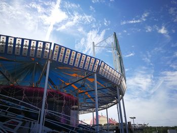 Low angle view of ferris wheel against sky