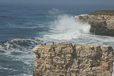 Waves splashing on rocks