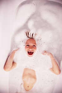 Close-up of young boy bathing