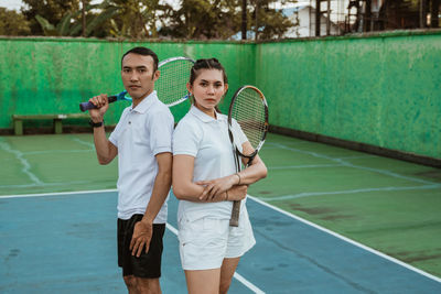 Portrait of young man playing tennis