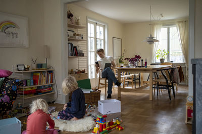 Father with daughters at home