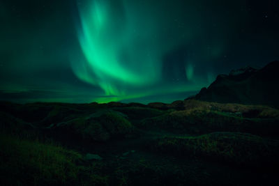 Landscape against sky at night