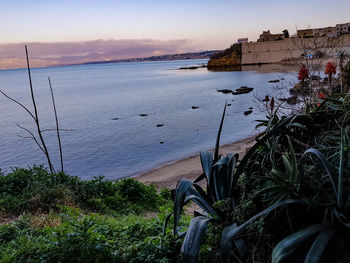 Scenic view of sea against sky during sunset