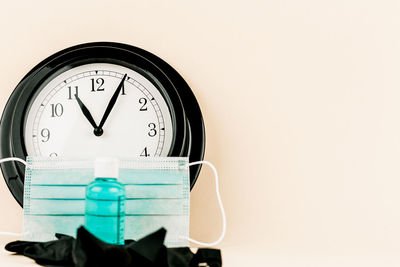 Close-up of clock against wall