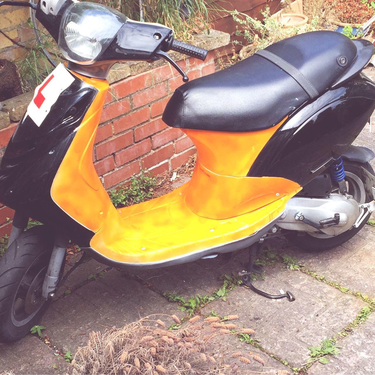 land vehicle, transportation, car, yellow, mode of transport, stationary, street, high angle view, parking, parked, bicycle, day, outdoors, sunlight, shoe, close-up, no people, motorcycle, still life, wheel