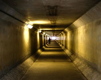 Tunnel illuminated with electric light