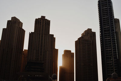 Low angle view of buildings against clear sky