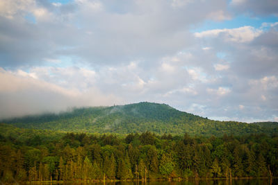 Scenic view of mountains against cloudy sky