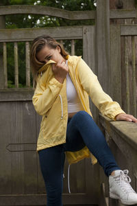 Portrait of woman standing at park