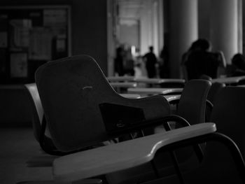 Close-up of chairs on table