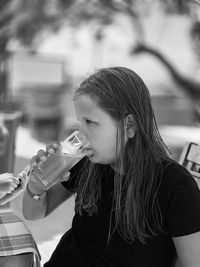 Young girl drinking water