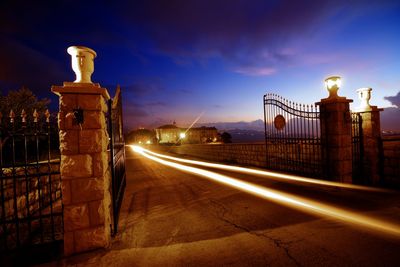 Illuminated tunnel at night