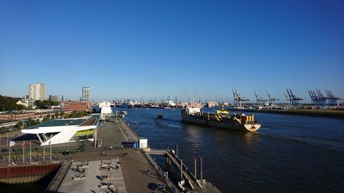 Boats moored at harbor