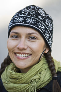 Portrait of young woman wearing knit hat