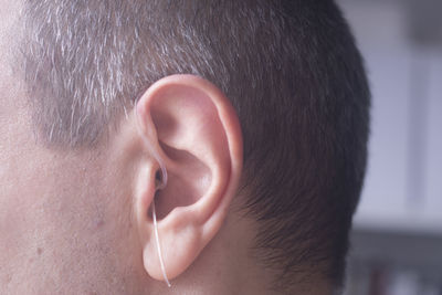 Close-up of man wearing hearing aid