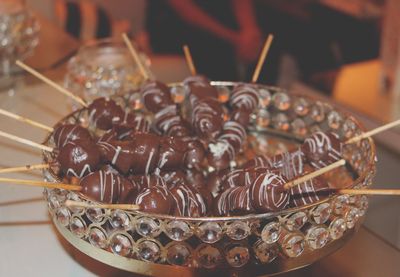 Close-up of desserts in glass plate on table