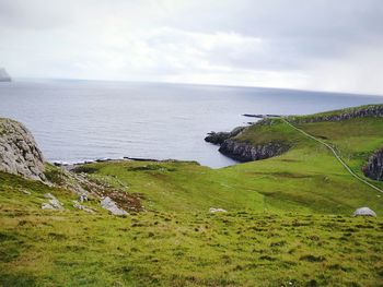 Scenic view of sea against cloudy sky