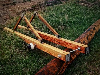 Wooden structure on grassy field